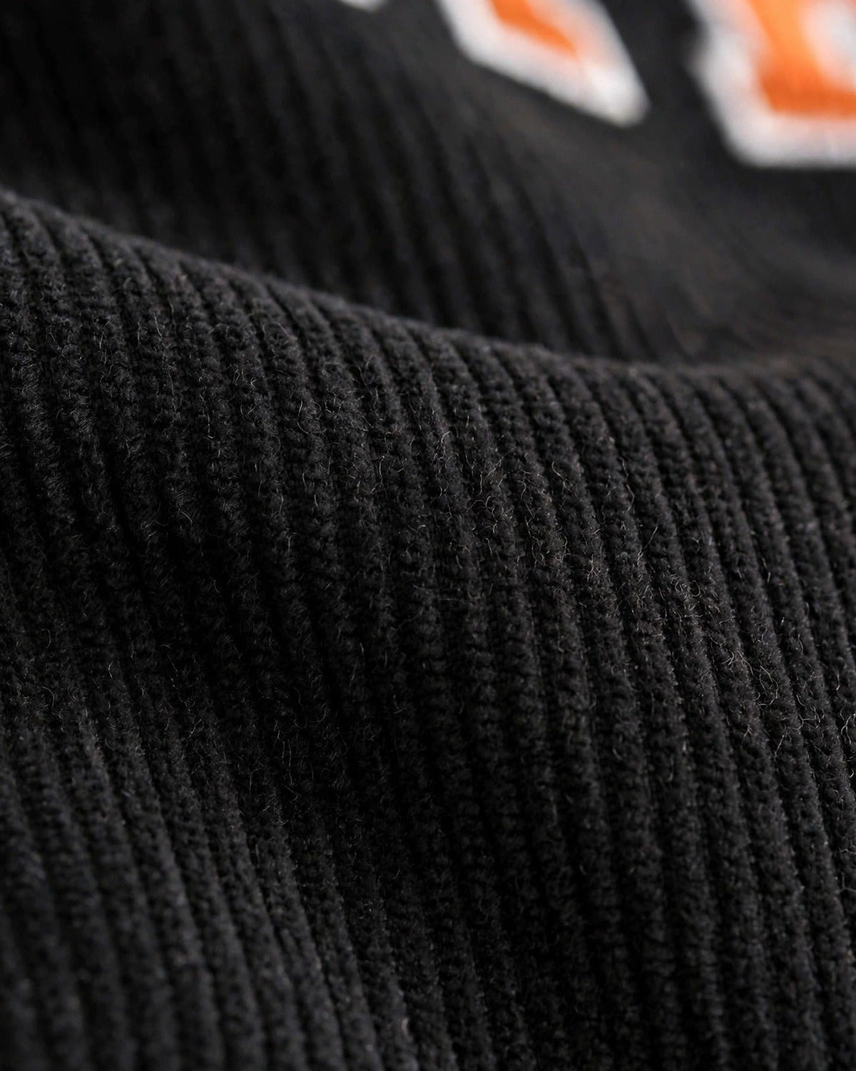 Custom Varsity Letter Corduroy Tote Bag – Black & Orange – fabric texture close-up