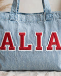 Light denim tote with ALIA in red chunky patch letters