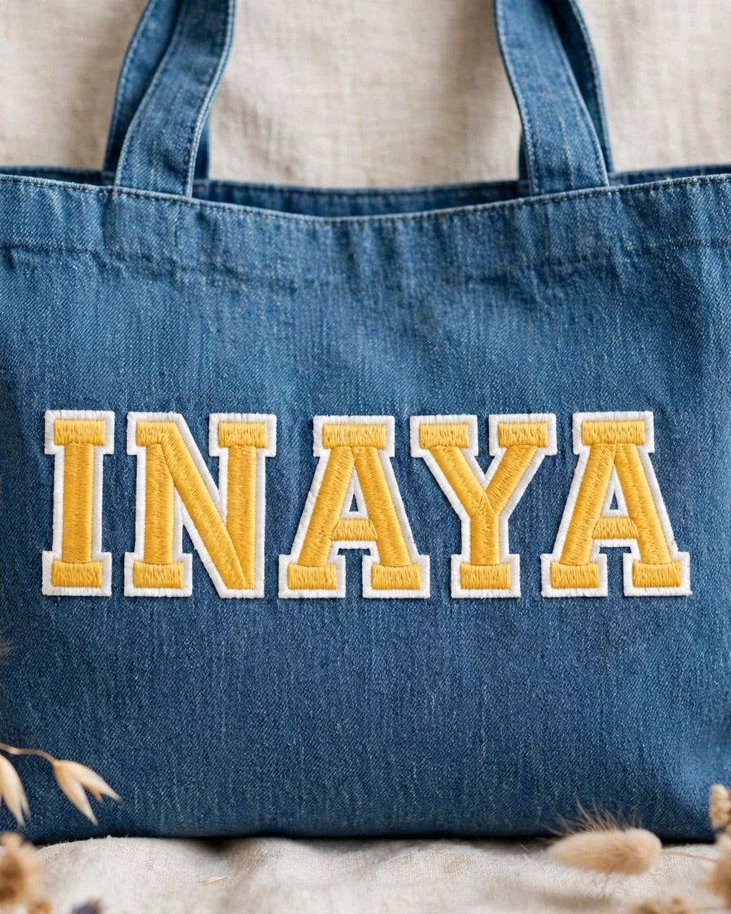 Medium denim tote with INAYA in yellow chunky patch letters